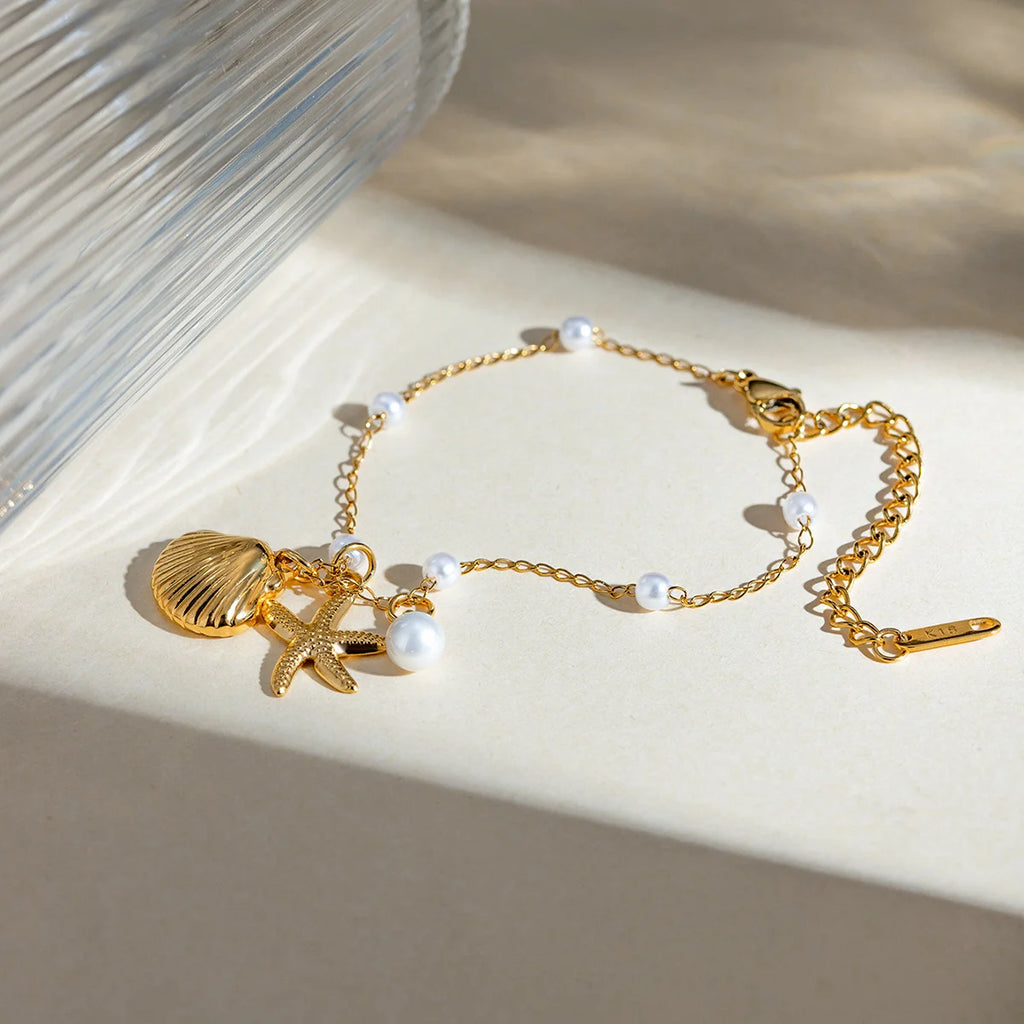 Fashion Jewelry 18K Gold Stainless Steel Pearl Chain with Summer Shell & Starfish Pendant Bracelet