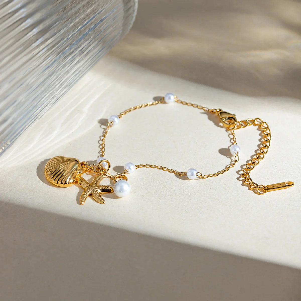 Fashion Jewelry 18K Gold Stainless Steel Pearl Chain with Summer Shell & Starfish Pendant Bracelet